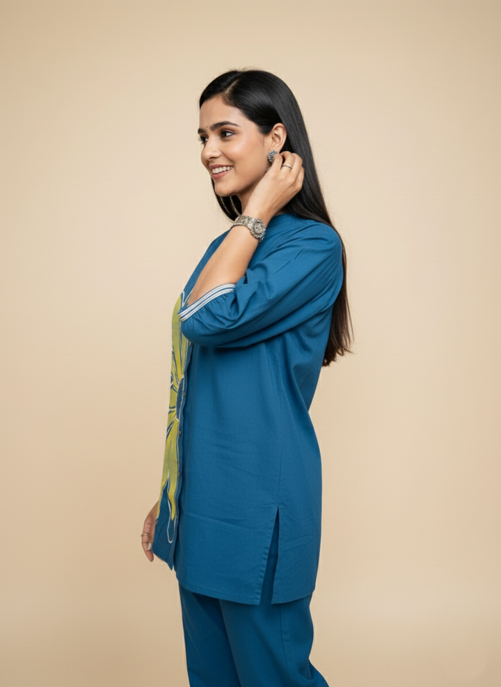 Woman wearing a blue outfit with a beige background